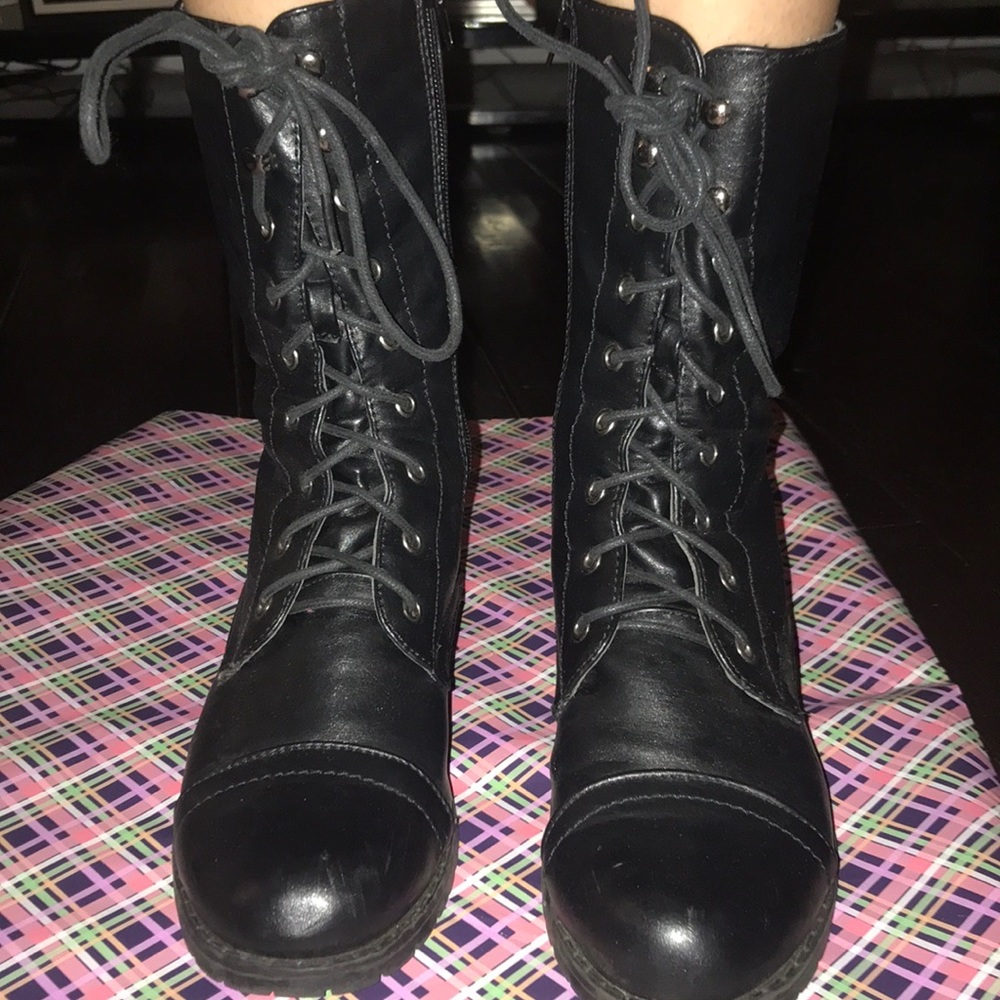 Black booted with straps all the up